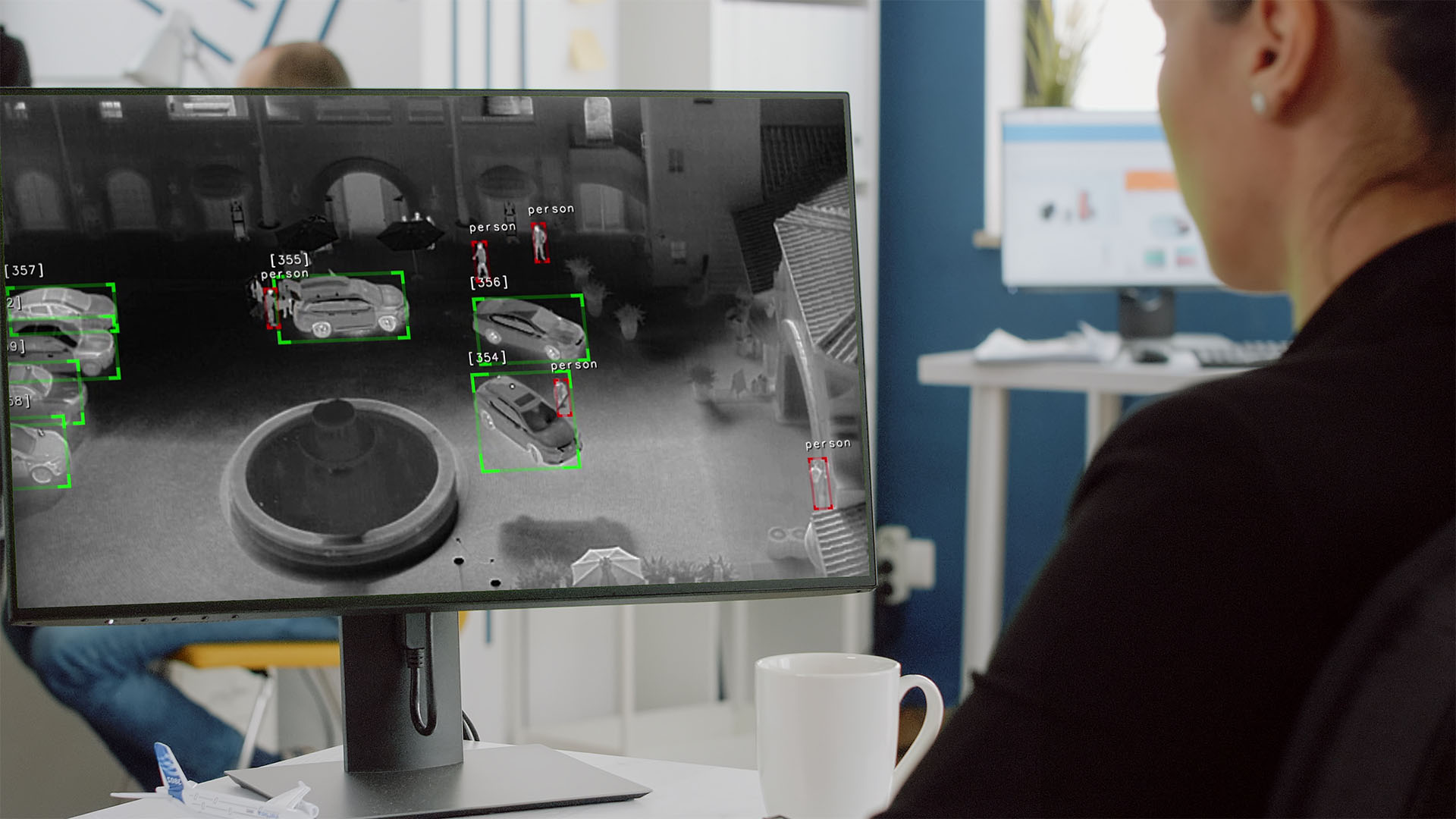 Person on Computer with Prism AI.jpg
