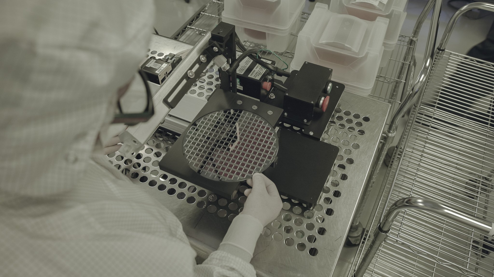 Human inspecting large wafer