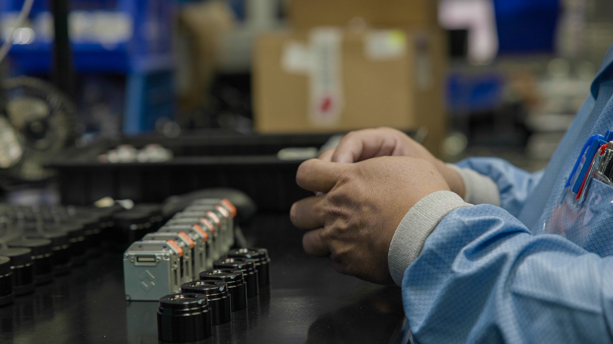 technician assembling camera